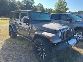Used 2014 Jeep Wrangler Unlimited Sahara w/ Dual Top Group image 1