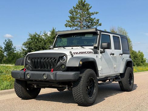 Used 2012 Jeep Wrangler Unlimited Rubicon w/ Dual Top Group AWD/4WD image 1