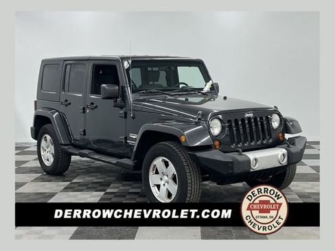 Used 2010 Jeep Wrangler Unlimited Sahara w/ Dual Top Group image 1