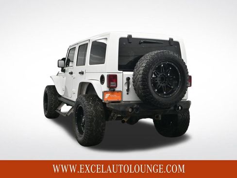 Used 2014 Jeep Wrangler Unlimited Sahara w/ Dual Top Group image 4