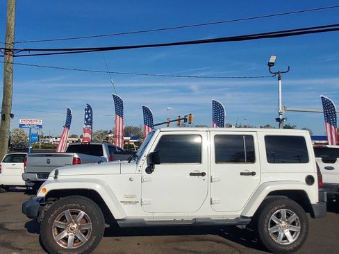 Used 2015 Jeep Wrangler Unlimited Sahara w/ Dual Top Group AWD/4WD image 2