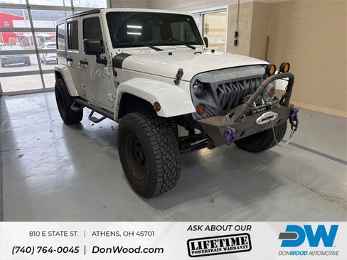 Used 2013 Jeep Wrangler Unlimited Sahara w/ Dual Top Group image 1