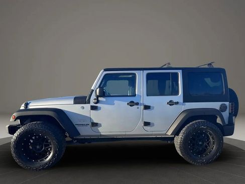 Used 2012 Jeep Wrangler Unlimited Sahara w/ Dual Top Group AWD/4WD image 4