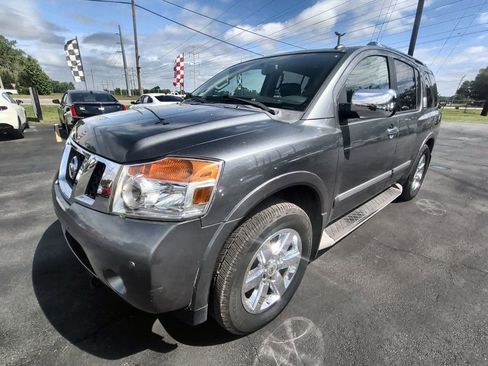 Used 2014 Nissan Armada Platinum w/ 2nd Row Captain Seat Package AWD/4WD image 1