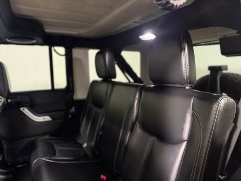 Used 2014 Jeep Wrangler Unlimited Sahara w/ Dual Top Group AWD/4WD image 22