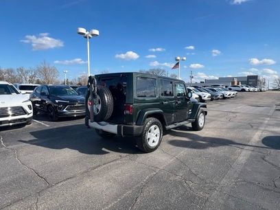 Used 2011 Jeep Wrangler Unlimited Sahara w/ Dual Top Group