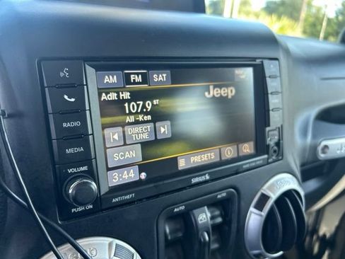 Used 2013 Jeep Wrangler Unlimited Sahara w/ Dual Top Group AWD/4WD image 16