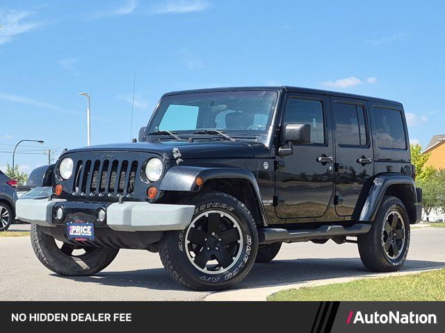 Used 2012 Jeep Wrangler Unlimited Sahara AWD/4WD image 1