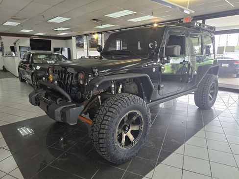 Used 2013 Jeep Wrangler Unlimited Sahara w/ Connectivity Group AWD/4WD image 1