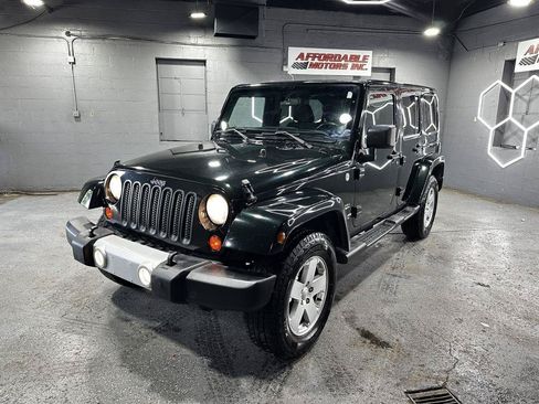 Used 2012 Jeep Wrangler Unlimited Sahara w/ Dual Top Group AWD/4WD image 2