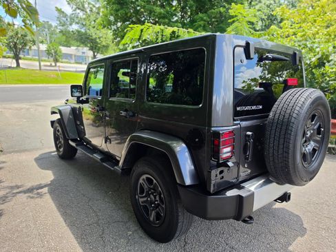 Used 2014 Jeep Wrangler Unlimited Sahara w/ Dual Top Group AWD/4WD image 7