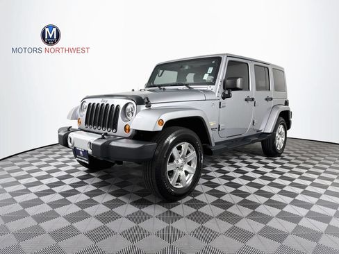 Used 2013 Jeep Wrangler Unlimited Sahara w/ Dual Top Group AWD/4WD image 1