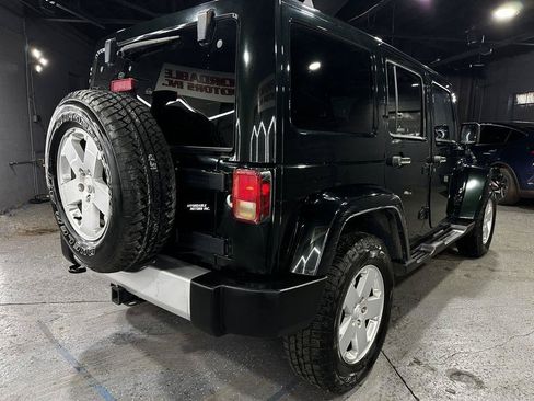 Used 2012 Jeep Wrangler Unlimited Sahara w/ Dual Top Group AWD/4WD image 6