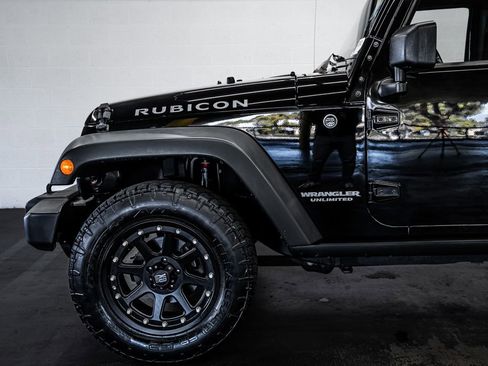 Used 2012 Jeep Wrangler Unlimited Rubicon w/ Dual Top Group AWD/4WD image 12