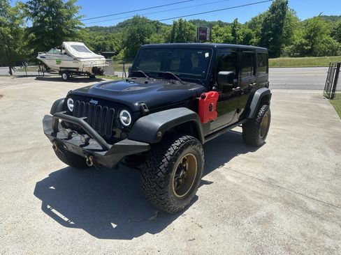 Used 2014 Jeep Wrangler Unlimited Rubicon w/ Dual Top Group AWD/4WD image 1