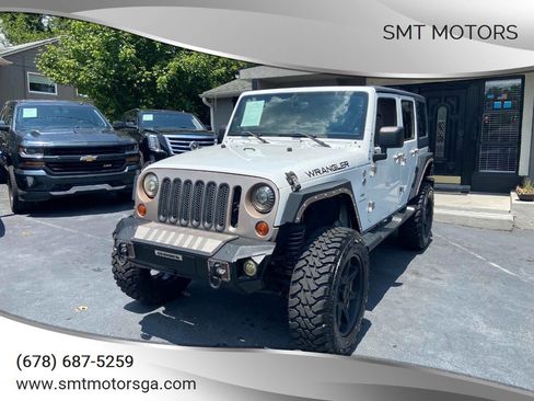 Used 2013 Jeep Wrangler Unlimited Sahara image 1
