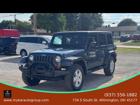 Used 2007 Jeep Wrangler Unlimited Sahara w/ Dual Top Group AWD/4WD image 1