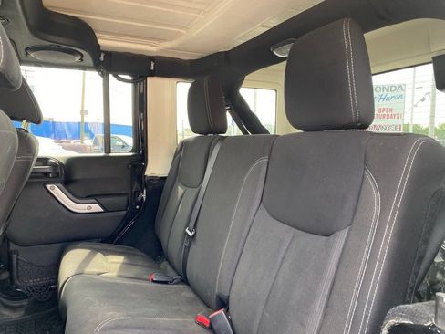 Used 2013 Jeep Wrangler Unlimited Sahara w/ Dual Top Group AWD/4WD image 14
