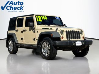 Used 2012 Jeep Wrangler Unlimited Sport w/ Dual Top Group AWD/4WD video 1