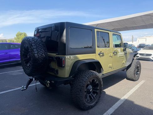 Used 2013 Jeep Wrangler Unlimited Rubicon w/ Dual Top Group AWD/4WD image 11