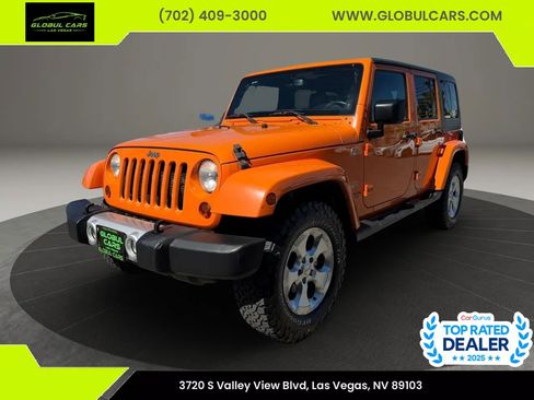 Used 2013 Jeep Wrangler Unlimited Sahara w/ Dual Top Group AWD/4WD image 1
