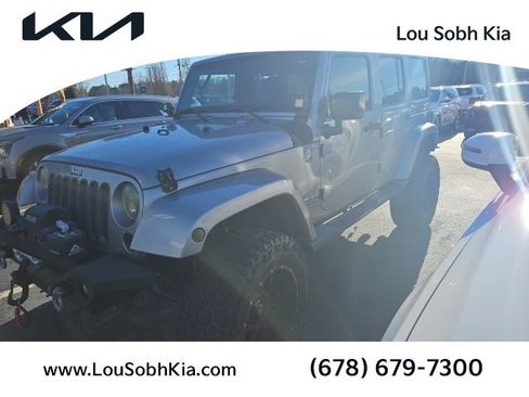 Used 2014 Jeep Wrangler Unlimited Sahara w/ Max Tow Package image 1