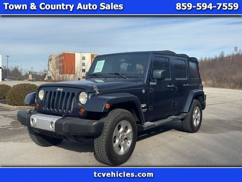 Used 2013 Jeep Wrangler Unlimited Sahara w/ Dual Top Group AWD/4WD image 1