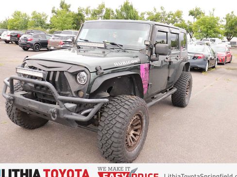 Used 2010 Jeep Wrangler Unlimited Rubicon w/ Dual Top Group AWD/4WD image 1