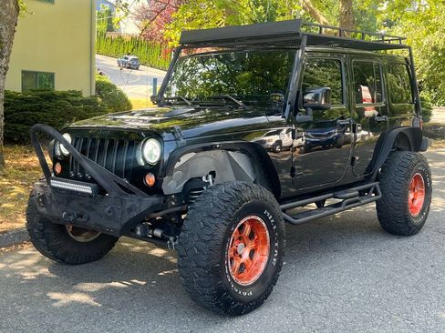 Used 2015 Jeep Wrangler Unlimited Sahara AWD/4WD image 1
