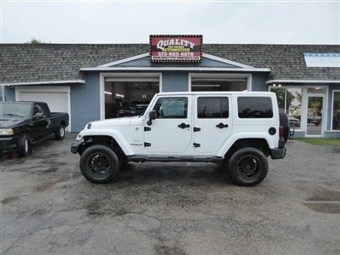 Used 2012 Jeep Wrangler Unlimited Sahara w/ Trailer Tow Group AWD/4WD image 1