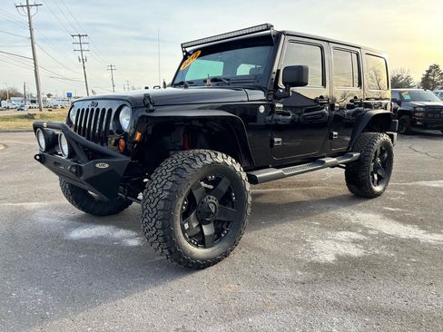 Used 2012 Jeep Wrangler Unlimited Sahara AWD/4WD image 1