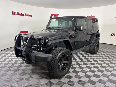 Used 2014 Jeep Wrangler Unlimited Sahara AWD/4WD image 1