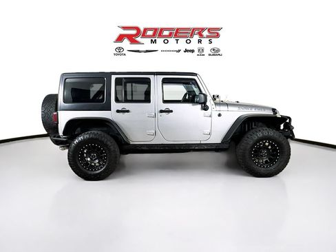 Used 2013 Jeep Wrangler Unlimited Sahara w/ Dual Top Group AWD/4WD image 9