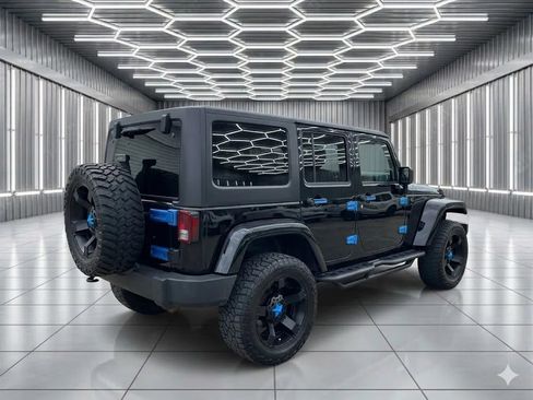 Used 2013 Jeep Wrangler Unlimited Sahara w/ Dual Top Group AWD/4WD image 3