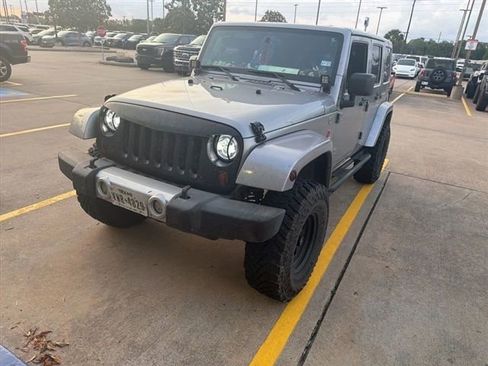 Used 2013 Jeep Wrangler Unlimited Sahara w/ Dual Top Group AWD/4WD image 1