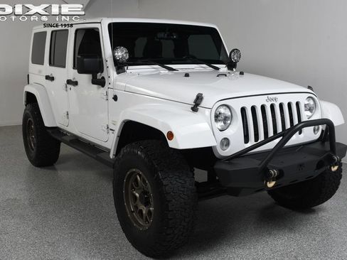 Used 2014 Jeep Wrangler Unlimited Sahara AWD/4WD image 1