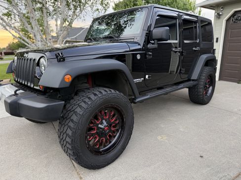 Used 2012 Jeep Wrangler Unlimited Sport w/ Black Appearance Group AWD/4WD image 4