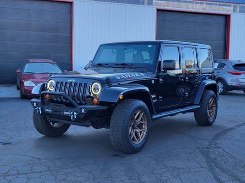 Used 2012 Jeep Wrangler Unlimited Sahara w/ Dual Top Group image 1