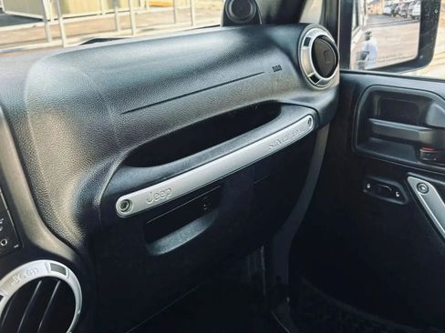 Used 2014 Jeep Wrangler Unlimited Sahara w/ Dual Top Group AWD/4WD image 32