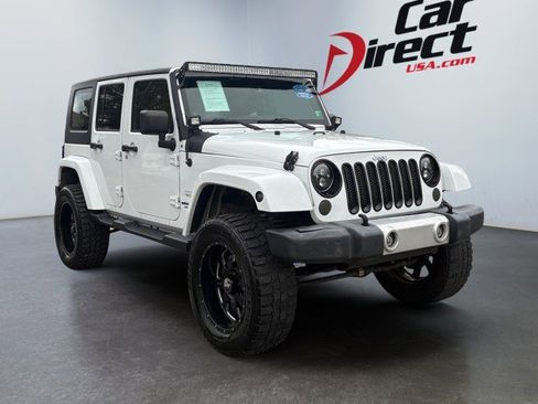 Used 2013 Jeep Wrangler Unlimited Sahara w/ Dual Top Group image 1