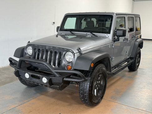 Used 2013 Jeep Wrangler Unlimited Sport AWD/4WD image 1