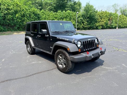 Used 2011 Jeep Wrangler Unlimited Rubicon w/ Dual Top Group AWD/4WD image 9