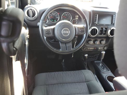 Used 2012 Jeep Wrangler Unlimited Sahara w/ Dual Top Group AWD/4WD image 9