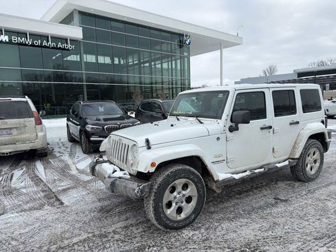 Used 2014 Jeep Wrangler Unlimited Sahara w/ Dual Top Group AWD/4WD image 1