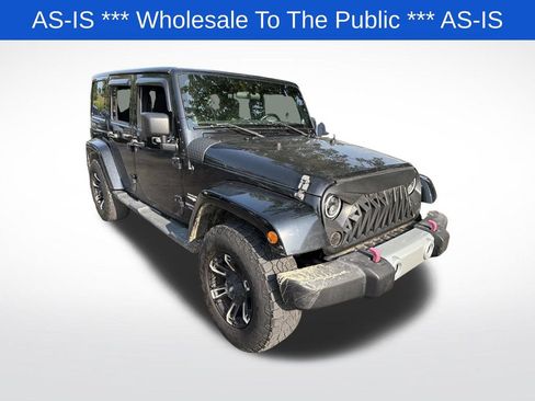 Used 2012 Jeep Wrangler Unlimited Sahara w/ Dual Top Group AWD/4WD image 1