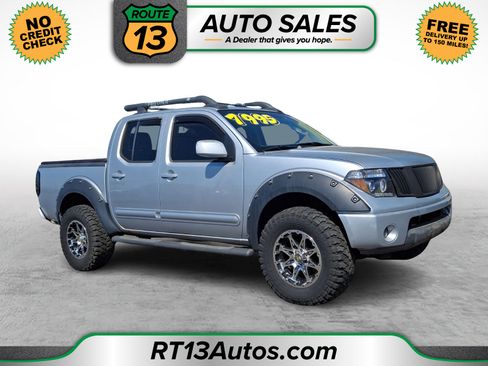 Used 2006 Nissan Frontier LE AWD/4WD image 1