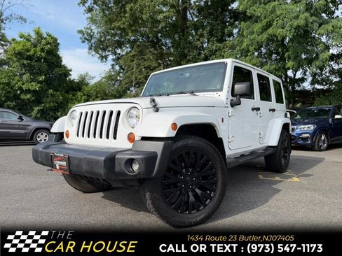 Used 2013 Jeep Wrangler Unlimited Sahara w/ Dual Top Group AWD/4WD image 2