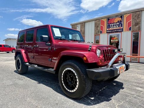 Used 2012 Jeep Wrangler Unlimited Sahara w/ Dual Top Group AWD/4WD image 1