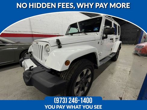Used 2014 Jeep Wrangler Unlimited Sahara w/ Dual Top Group image 1