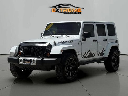 Used 2012 Jeep Wrangler Unlimited Sahara w/ Dual Top Group AWD/4WD image 2
